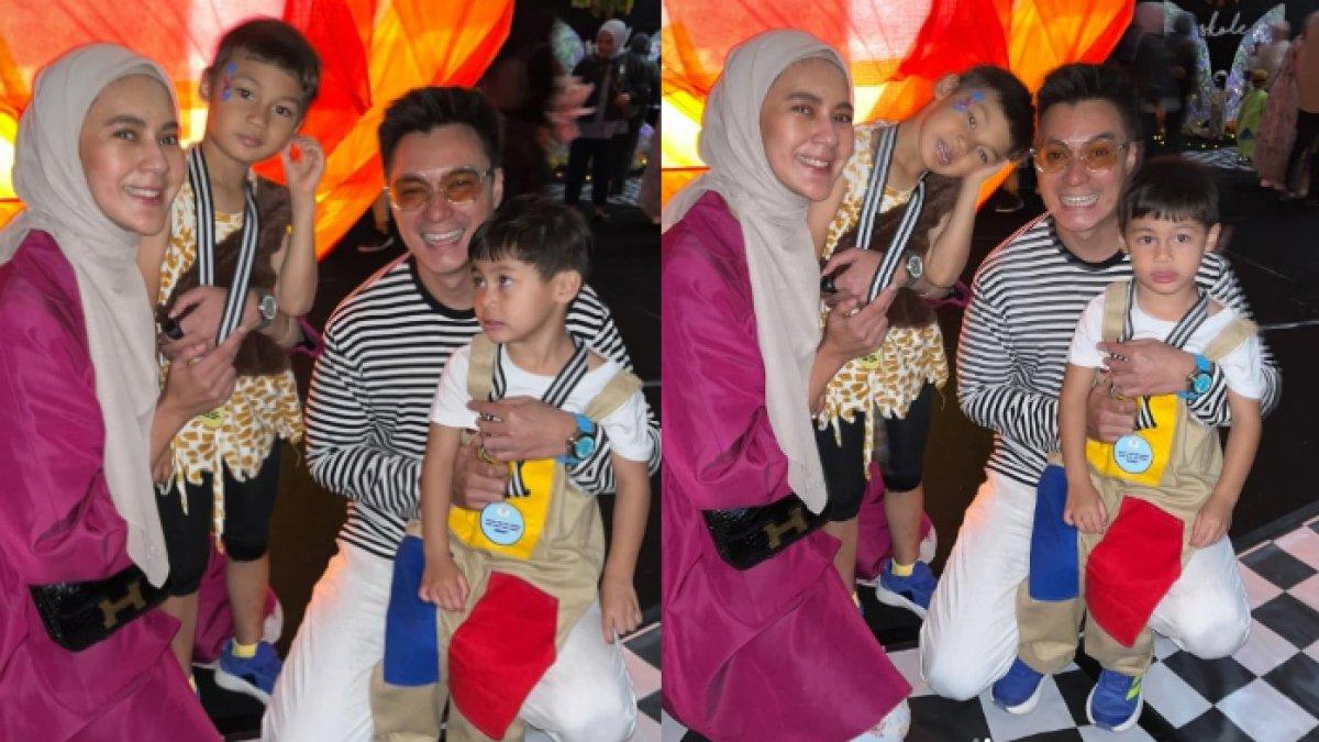 KEKOMPAKAN BAIM PAULA - Baim Wong dan Paula berdiri berdampingan, tersenyum lebar di antara kedua buah hati mereka yang sedang merayakan kelulusan sekolah.