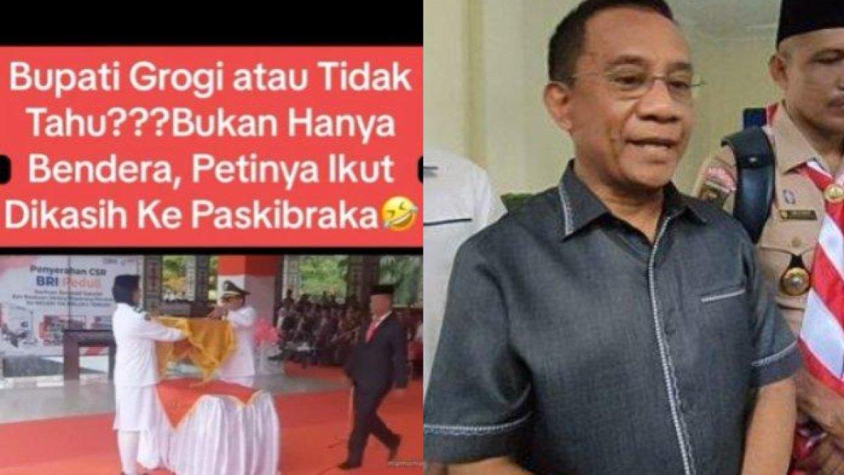 Pj Bupati Maluku Tengah terekam memberikan bendera merah putih sekaligus petinya kepada paskibraka pembawa baki.