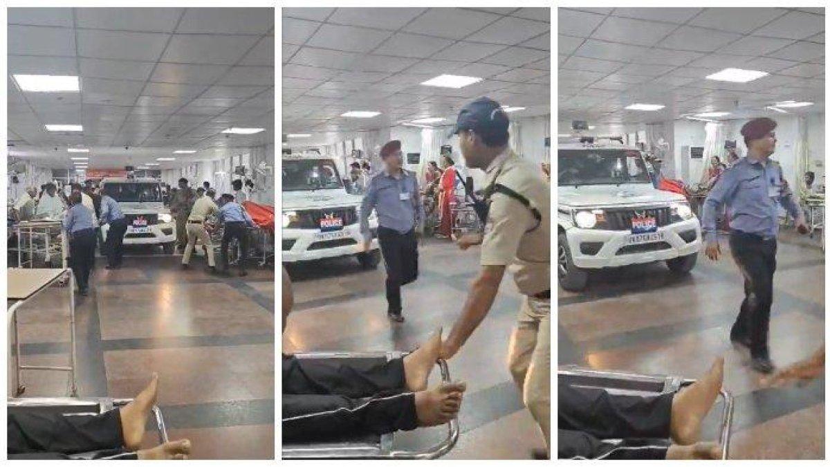 Polisi India mengendarai mobil SUV di bangsal IGD rumah sakit AIIMS di Rishikesh, Uttarkhand, untuk menangkap Satish Kumar, seorang perawat yang diduga melakukan pelecehan seksual.