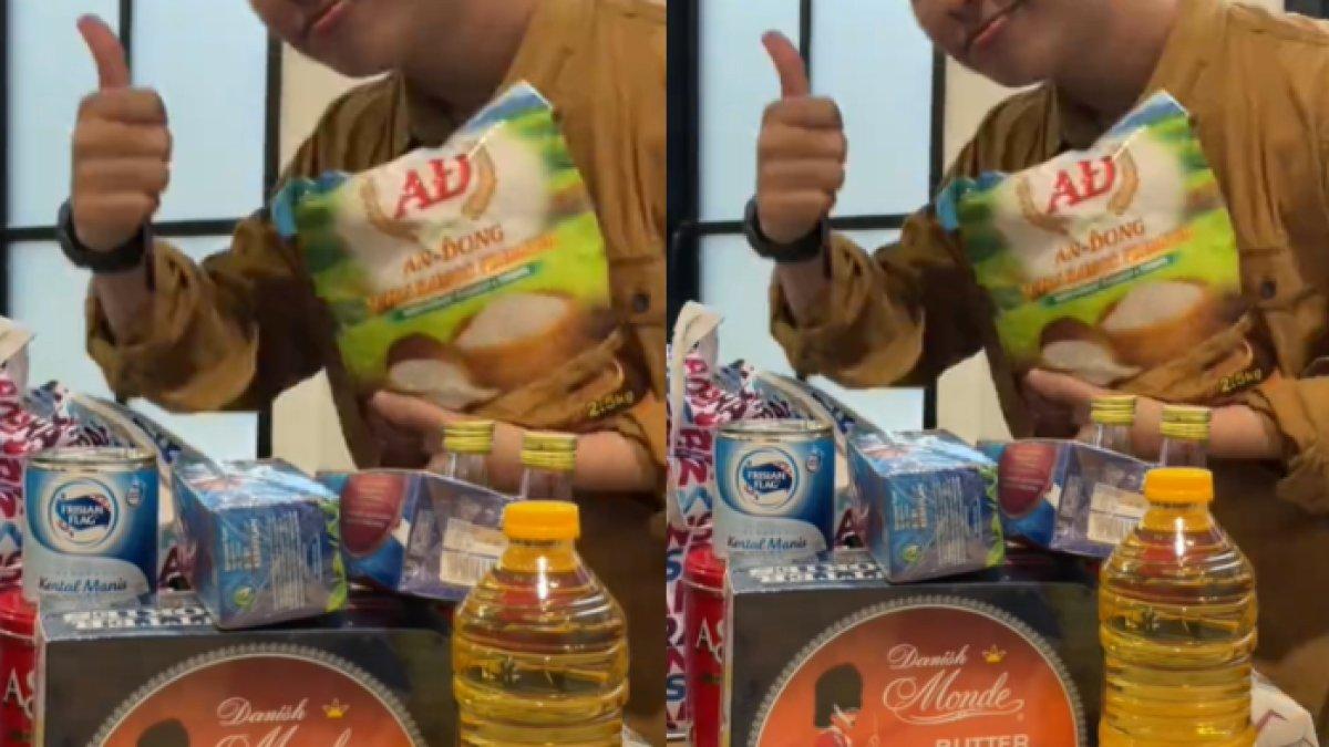 Raffi Ahmad dan Nagita Slavina memberikan beras seberat 2,5 kilogram