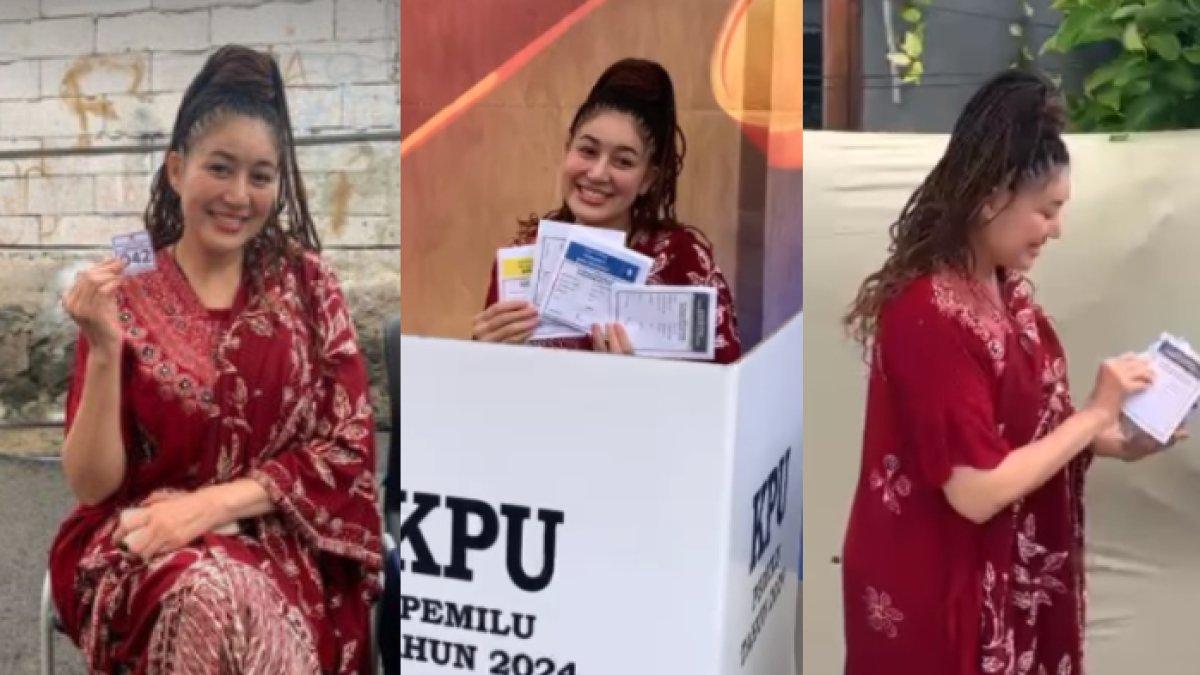 Sania memakai daster warna merah