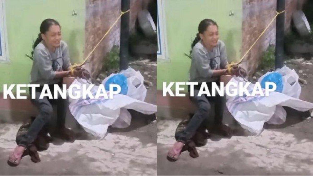 Potret wanita yang ternyata maling. Ia menangis diikat warga di tiang usai kepergok mencuri sepeda anak.