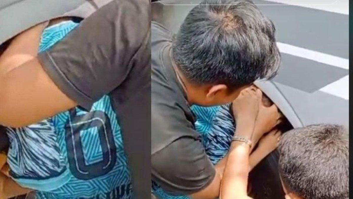 Tangkapan layar video viral kepala bocah nyangkut di kolong roda bus.