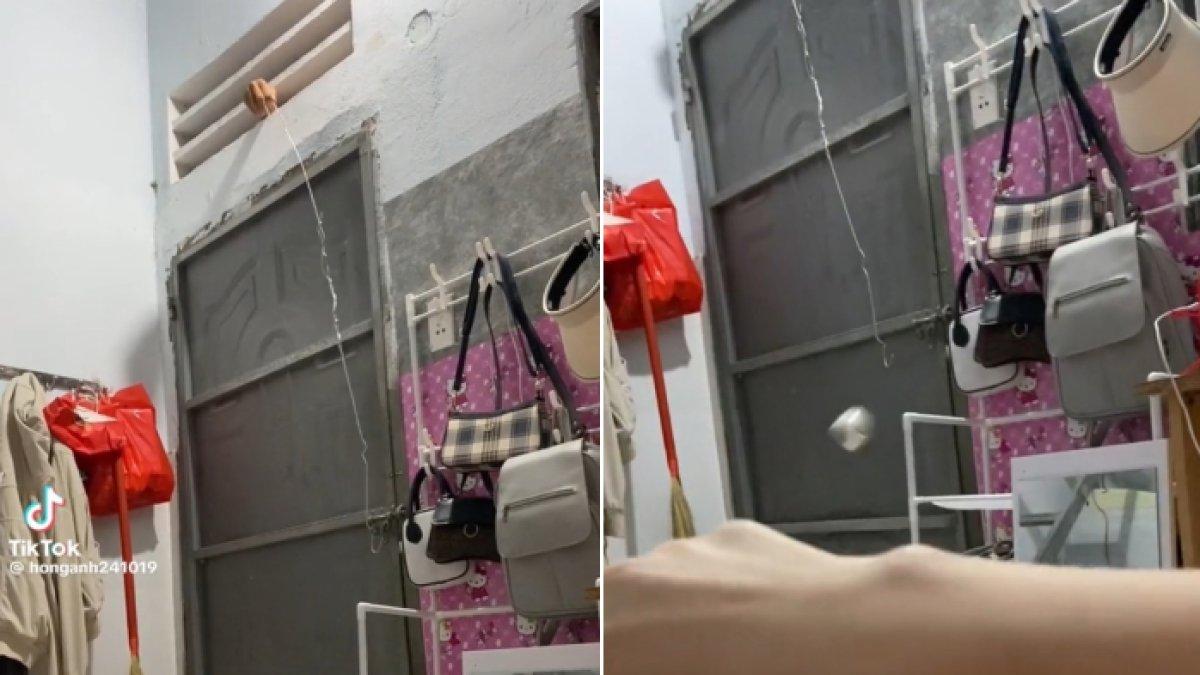 Wanita di Vietnam pergoki pencuri mencoba membuka kunci kamar kosnya dari luar.