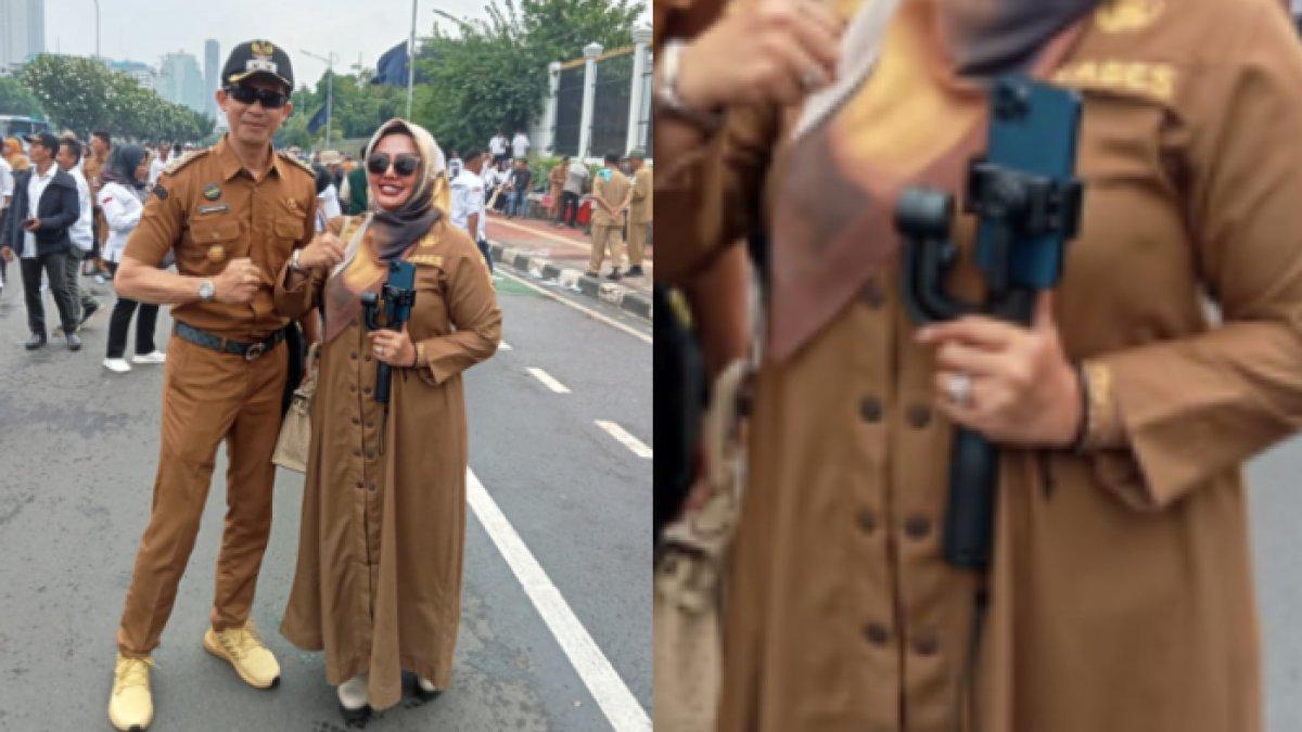 Wiwin membawa iPhone hingga gimbal