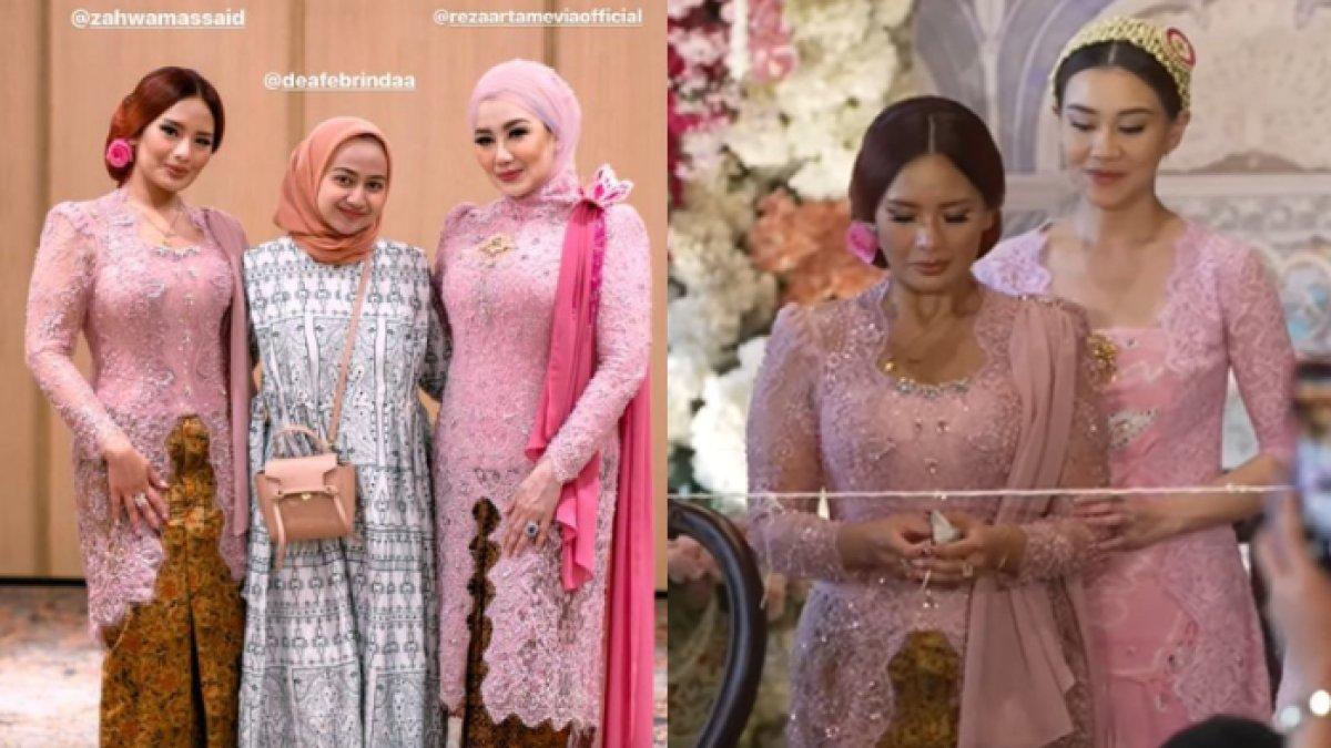 Zahwa Massaid memakai kebaya warna pink yang dipadukan dengan bawahan rok batik.