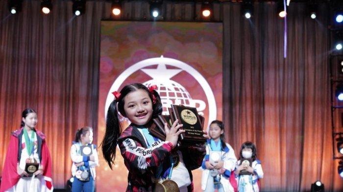 Arsy dalam ajang perlombaan WCOPA 2022.