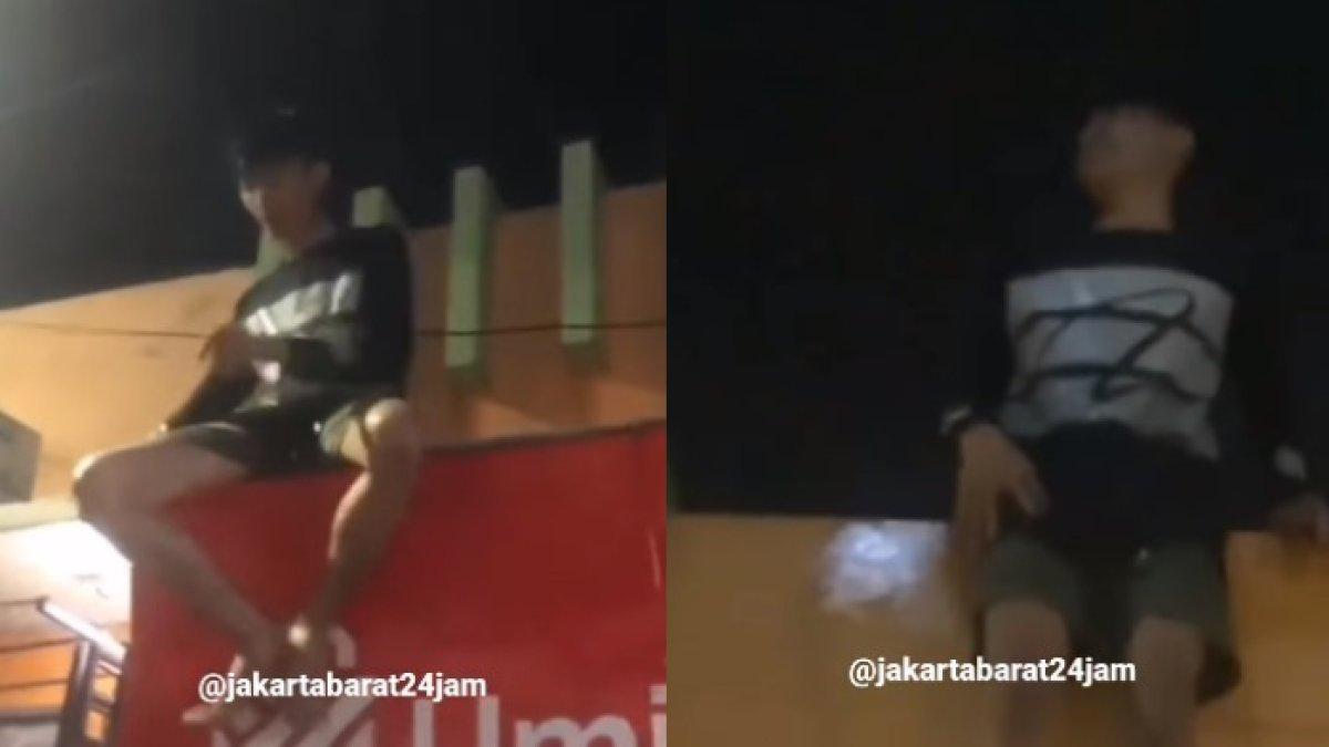 Seorang pria nekat naik ke atas genting usai kepergok mencuri.