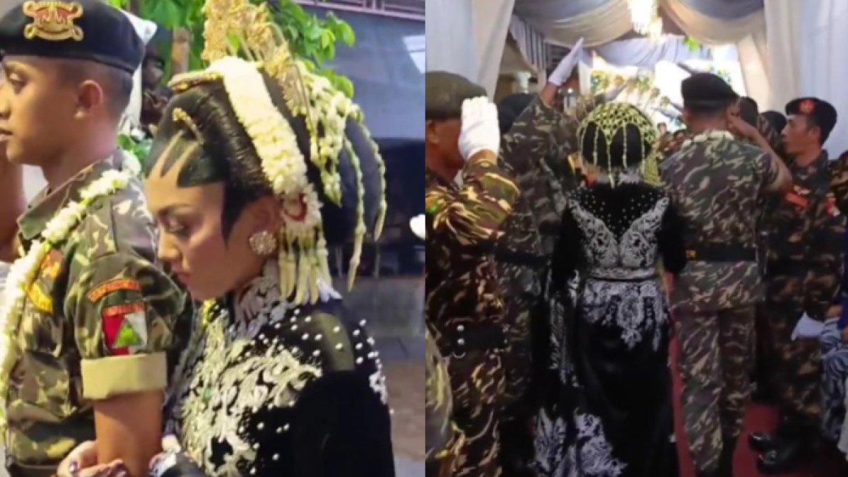 Pengantin berseragam banser disambut bak prajurit TNI.