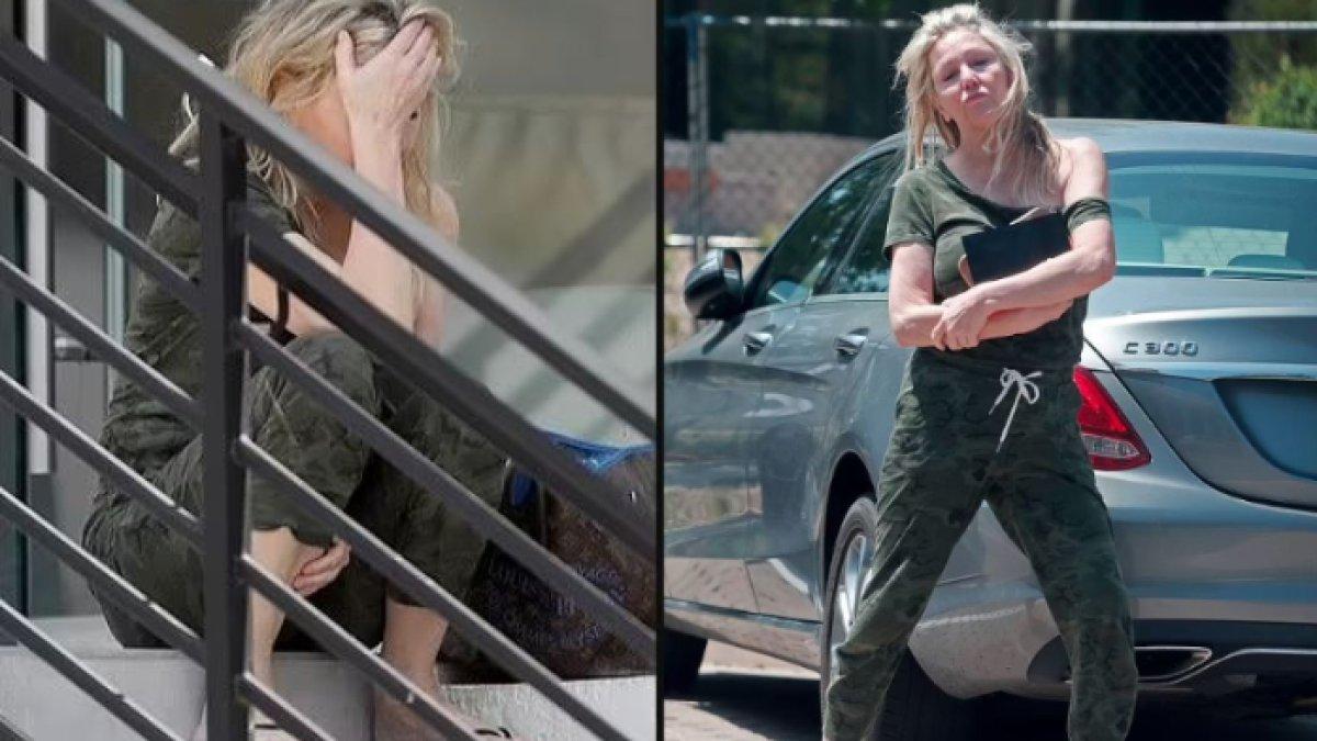 Seorang artis terlihat berusaha menyeimbangkan diri di pagar gedung dan berbicara sendiri.