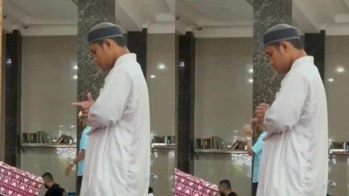 Video seorang pria tuna rungu salat menggunakan bahasa isyarat