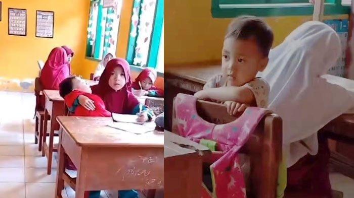 Nuraeni menggendong adiknya saat mengikuti pembelajaran di sekolah