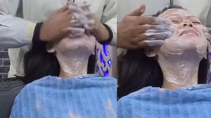 Wajah Lorian digosok dengan cepat oleh pria di salon India
