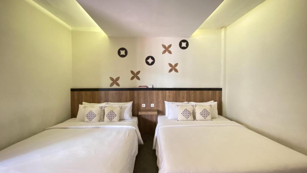 Ilustrasi tipe kamar yang ada di Mawar Asri Hotel
