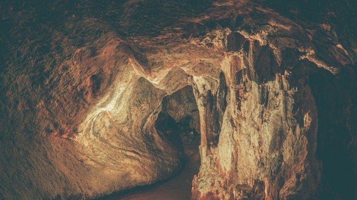 Ilustrasi gua dengan lubang masuk yang sempit.