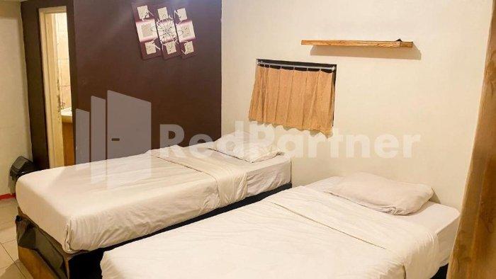 Ilustrasi kamar Audah Guesthouse Syariah Kuningan RedPartner, Jakarta, menawrkan kamar berfasilitas lengkap dan dengan harga terjangkau.