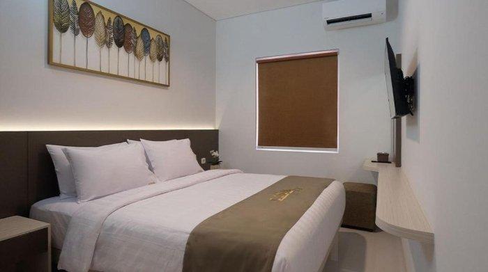 Kamar penginapan di Cozzy Stay Semarang by Sinergi Semarang, Jawa Tengah.