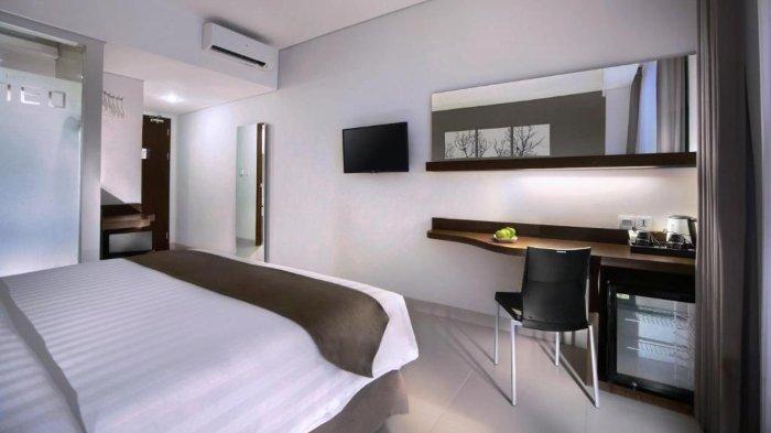 Kamar penginapan di Hotel Neo Denpasar by ASTON Denpasar, Bali.