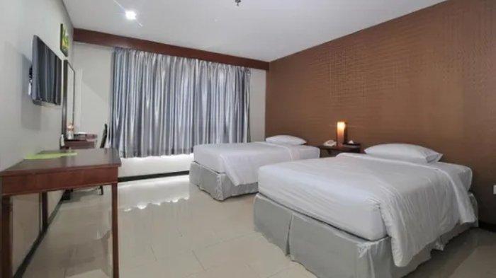 Kamar penginapan di The Kanjeng Suites Kuta Galeria - Bali.