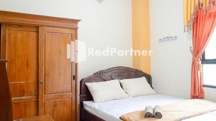 Kamar penginapan di hotel PKPN Syariah Boyolali Mitra RedDoorz, Jawa Tengah.