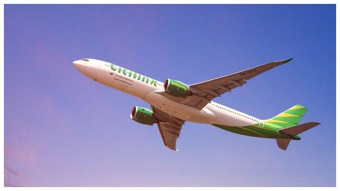 Pesawat Citilink yang sedang mengudara.