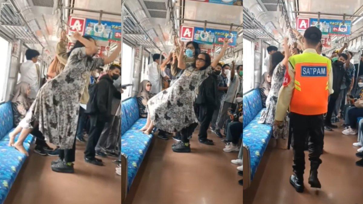Seorang wanita nekat bergelantungan di KRL dan usir penumpang lain.