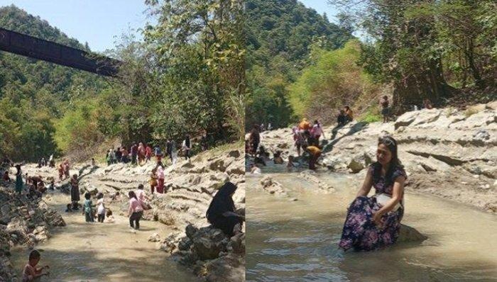 Para pengunjung sedang bermain air di objek wisata Watu Lempit di Girikusumo Desa Banyumeneng, Mranggen, Demak, Minggu (19/9/2021).