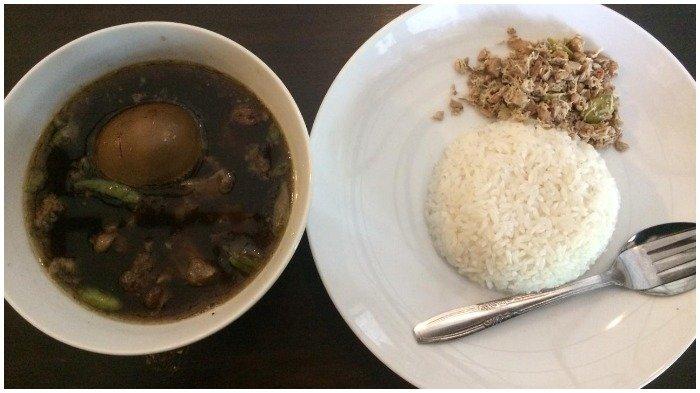 Seporsi Garang Asem Haji Masduki yang disajikan bersama nasi megono.
