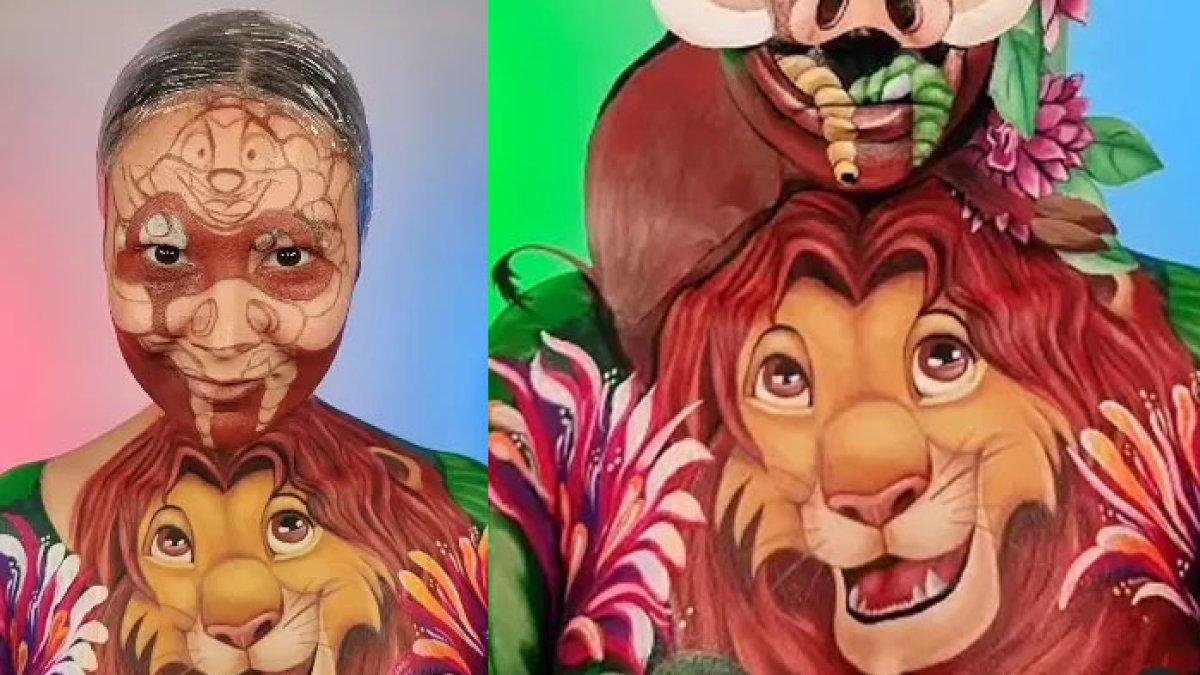 Bak lukisan, terntara gambar kartun The Lion King ini hasil karya seorang wanita yang merias wajah dan tubuhnya