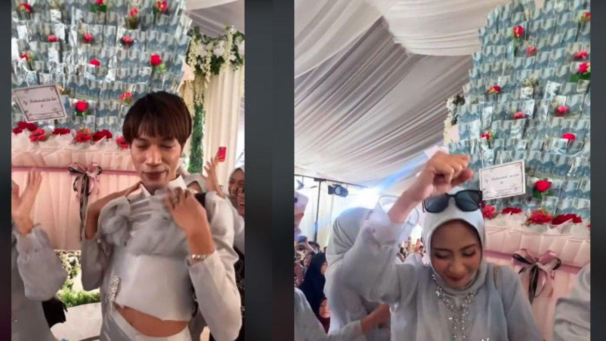 Bridesmaid sumbang buket bunga uang raksasa ke sebuah pernikahan