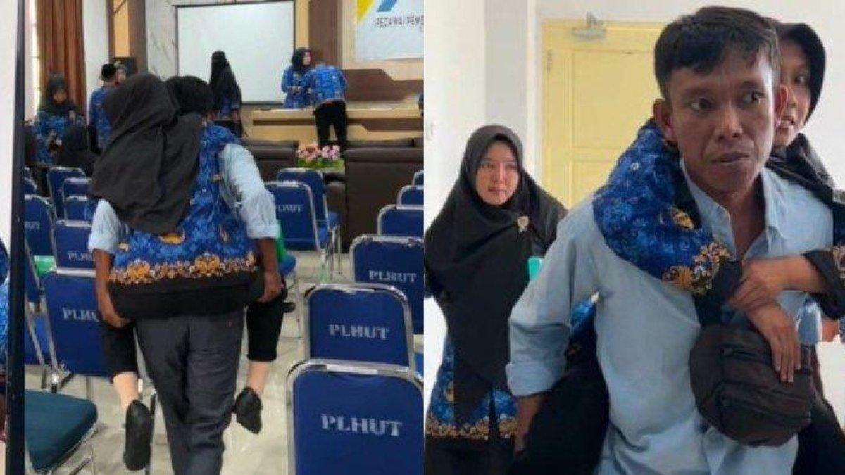 VIRAL DIGENDONG SUAMI - Fadly menggendong istrinya, Evi Nurjannah, menuju aula pelantikan PPPK Kemenag Luwu Timur, Selasa (27/5/2025). Momen haru ini viral dan menyentuh banyak hati.