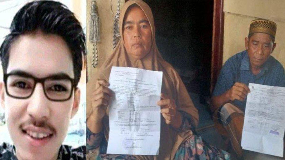 Fauziah, ibu kandung Imam Masykur (25) memperlihatkan surat laporan polisi atas kematian putranya di rumah mereka di Desa Mon Keulayu, Kecamatan Gandapura, Kabupaten Bireuen, Provinsi Aceh, Minggu (27/8/2023)