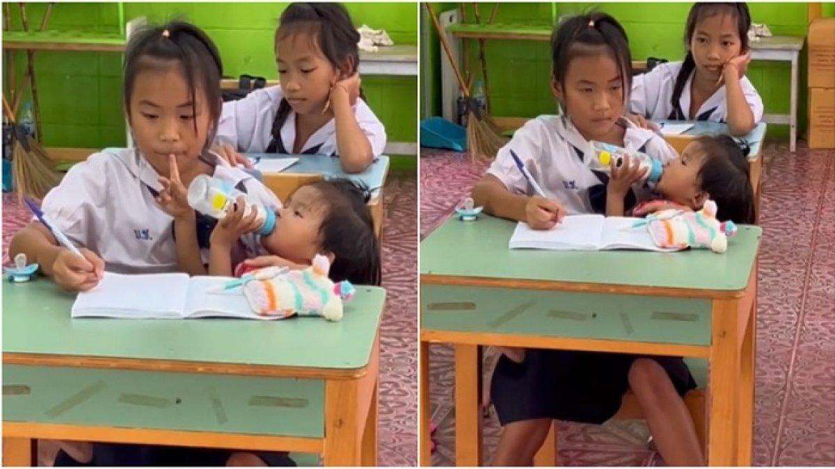 Gadis berusia 10 tahun merawat adik sambil ujian di sekolahan.