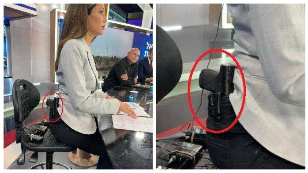 Foto Lital Shemesh, presenter berita Channel 14 Israel, membawa satu senjata di pinggangnya ketika melakukan siaran di studio pada Selasa (2/1/2024).