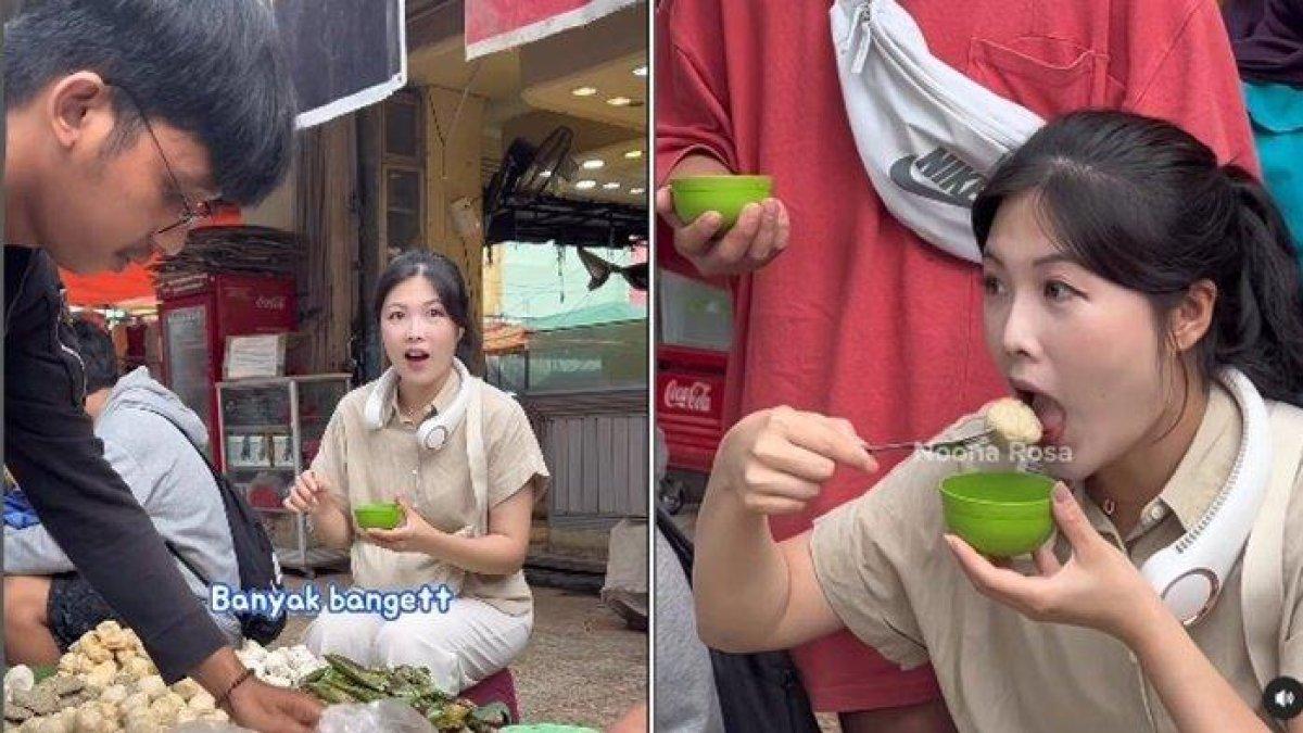 Kreator konten spesialis kuliner asal Korea Noona Rosa, menyantap pempek di Pasar 16 Ilir Kota Palembang.