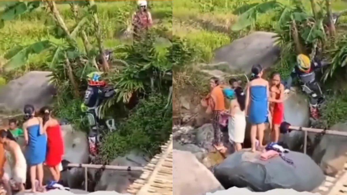 Pengendara motor cross jatuh di sungai tempat banyak wanita mandi