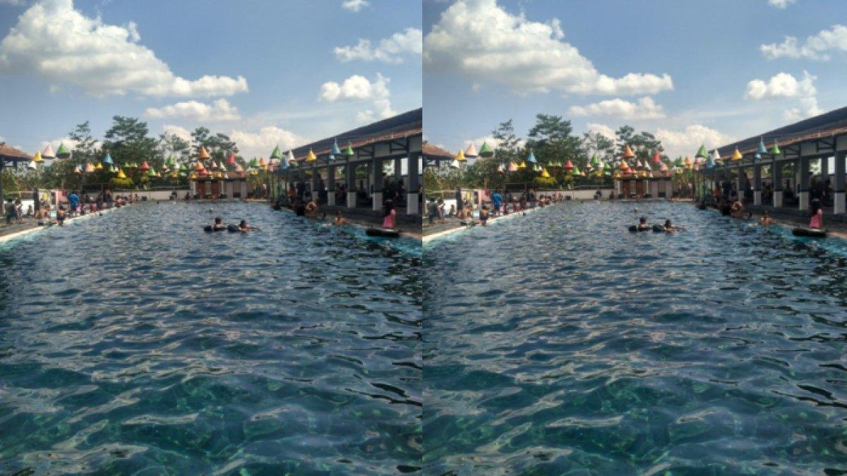 Pengunjung memadati kawasan pemandian Umbul Pluneng, Desa Pluneng, Kecamatan Kebonarum, Klaten, Minggu (28/10/2018).
