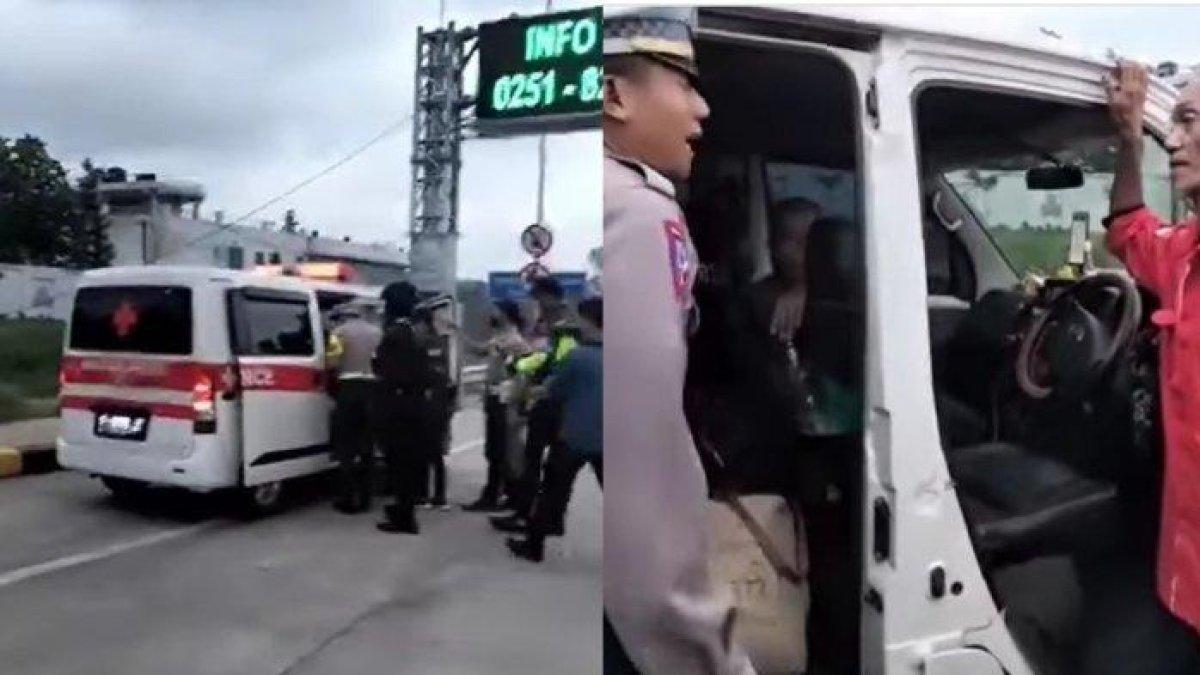 Polisi menghentikan sebuah ambulans di exit tol Parungkuda, Kabupaten Sukabumi, Jawa Barat, usai berkendara ugal-ugalan melawan arus one way Tol Bocimi pada masa arus balik Lebaran 2024, Senin (15/4/2024).