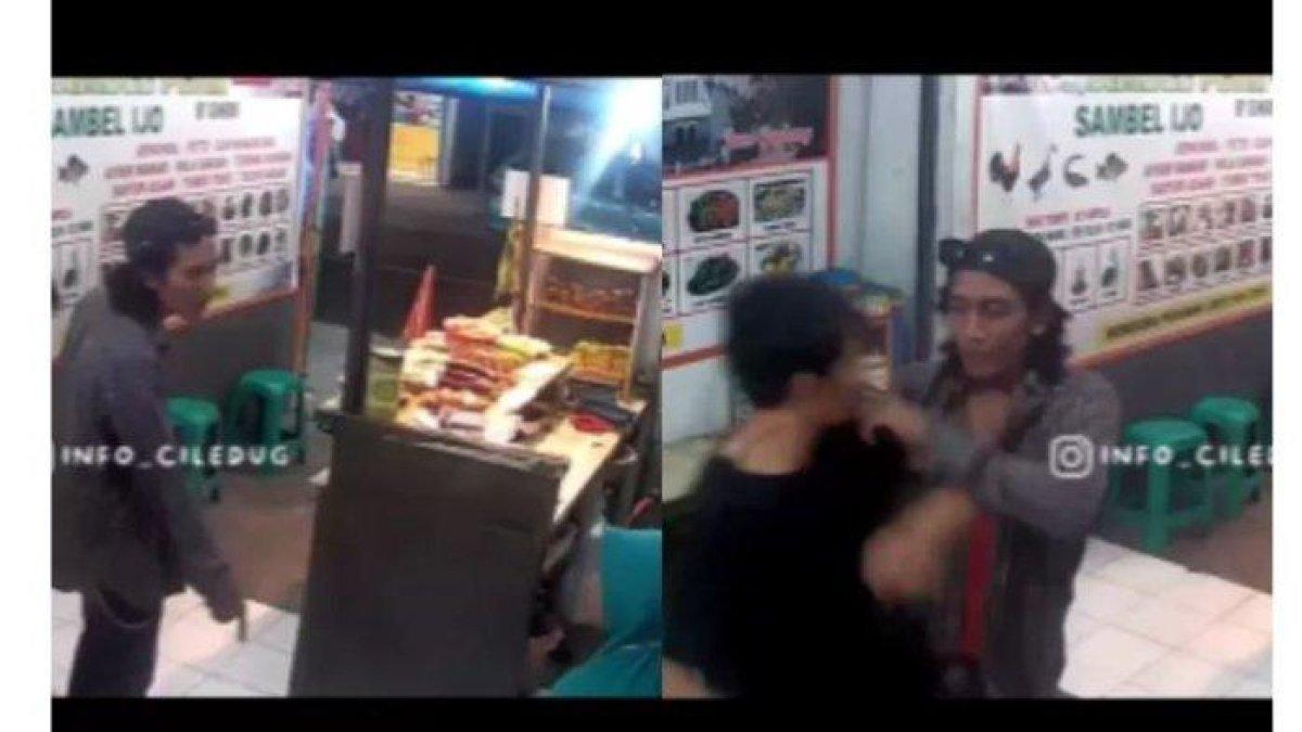 Seorang pria di Ciledug mengamuk bahkan nyaris menganiaya penjual pecel ayam hanya karena pesanannya tak sesuai. Aksi sok jago pria tersebut terekam kamera CCTV dan viral di media sosial.
