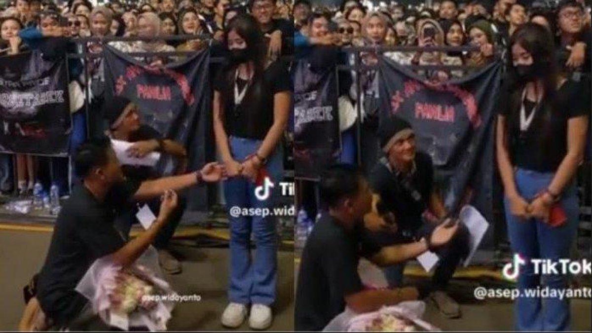 Pria lamar kekasih di tengah konser, tahan malu cintanya ditolak