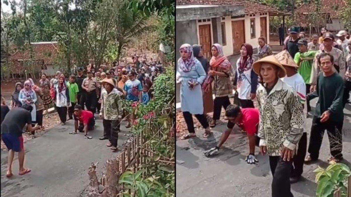 Sebuah video memperlihatkan aksi seorang warga berjalan merangkak beredar viral di media sosial.