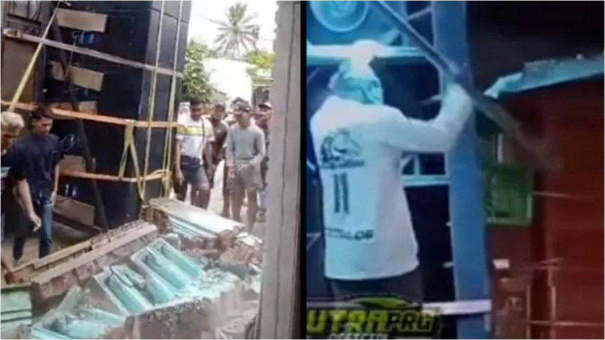 Sejumlah pria tampak merobohkan pagar rumah milik warga agar parade sound system bisa lewat.