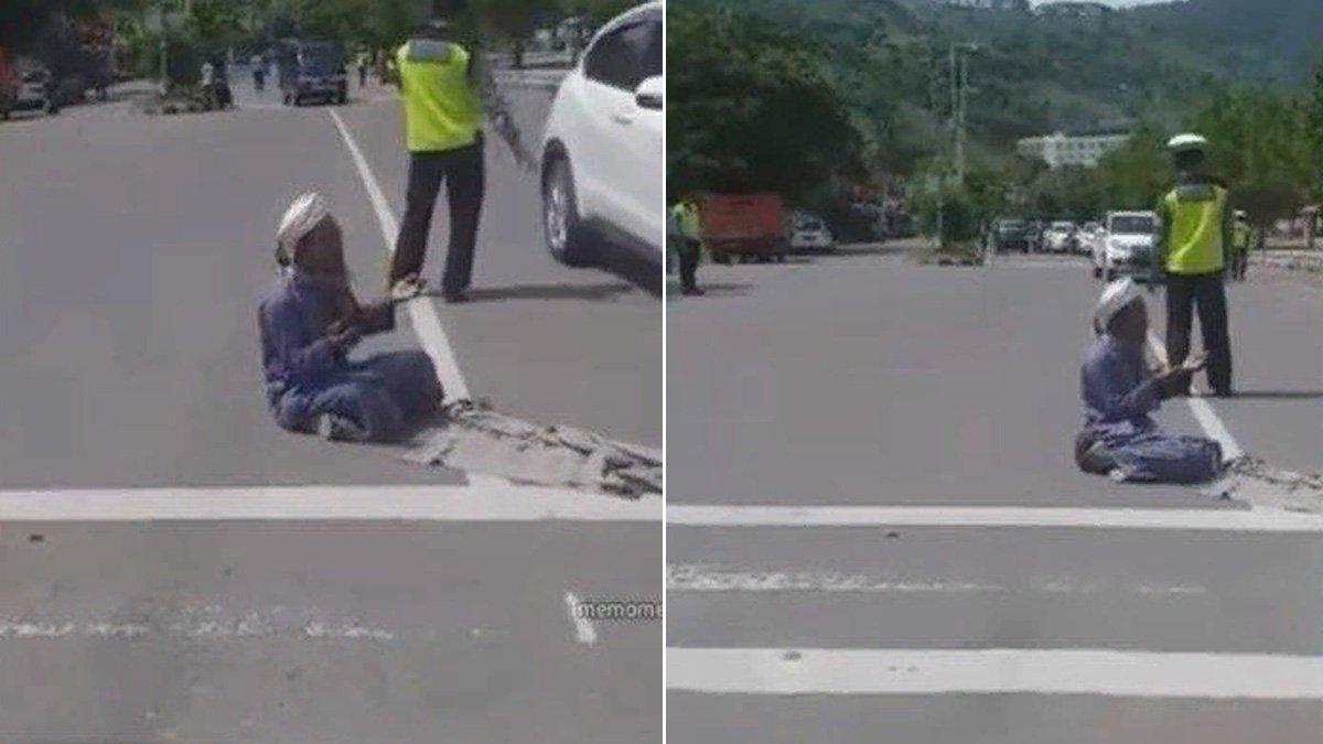 Seorang pria paruh baya berdoa meminta agar polisi medapatkan azab, di tengah jalan viral di media sosial