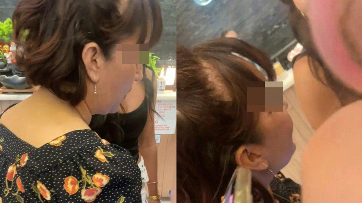 Seorang wanita berpakaian seksi dimarahi emak-emak di tempat umum.