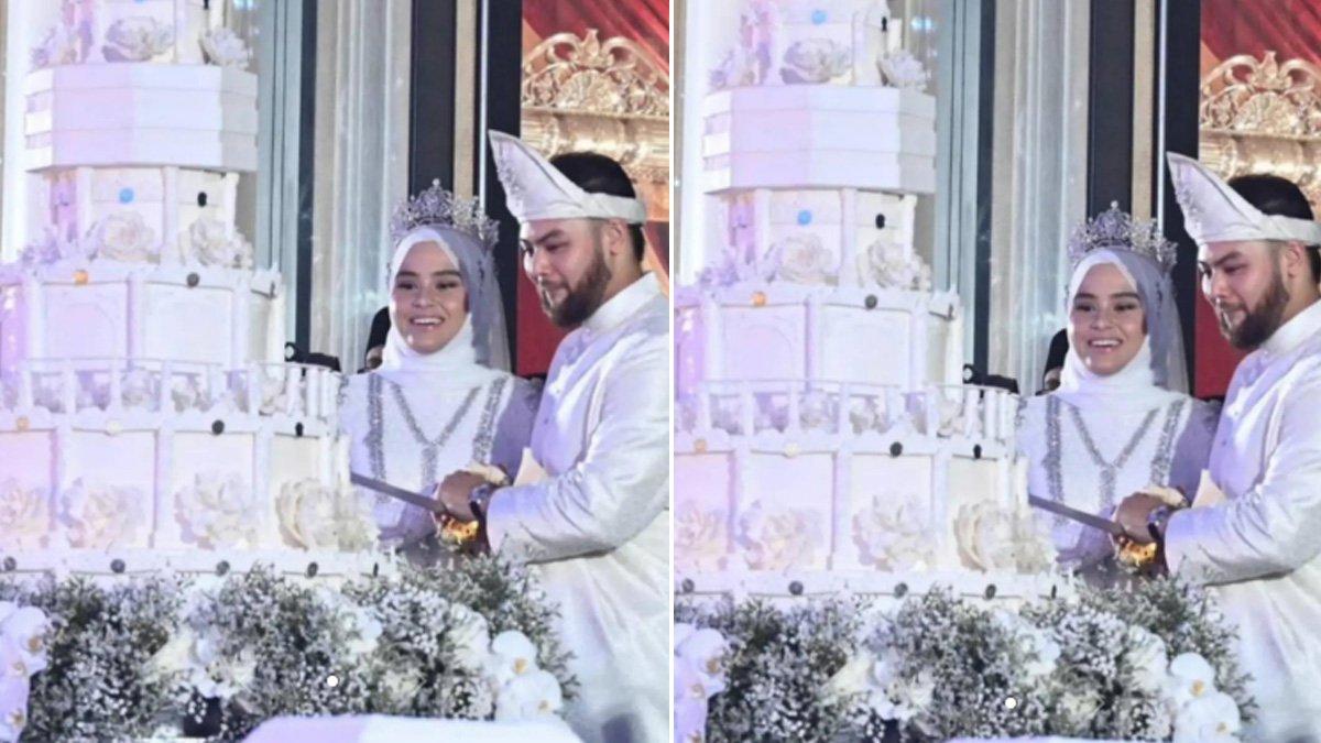 Tengku Puteri Afzan Aminah Hafidzatullah dan FD Idzham FD Iskandar melakukan potong kue.