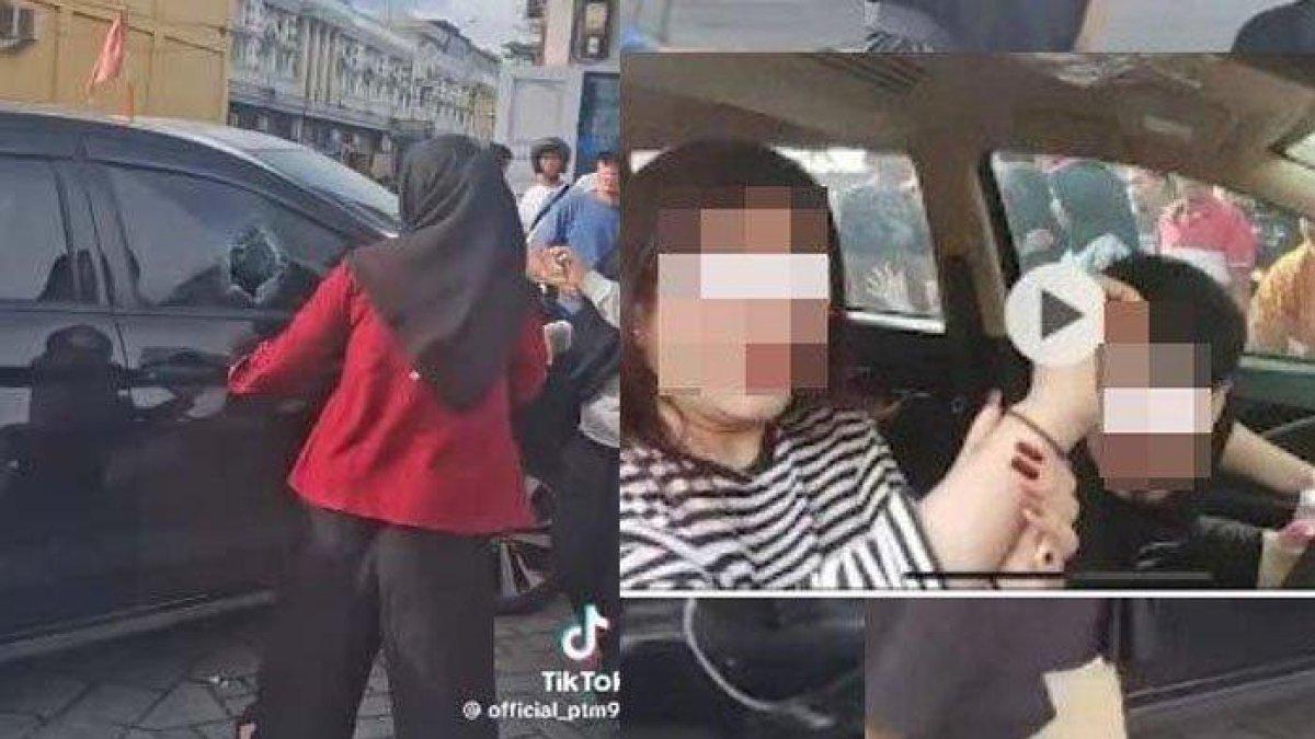 VIRAL PNS SELINGKUH: Tangkapan layar momen seorang wanita diduga istri sah sedang memecahkan kaca mobil pelakor, Minggu (16/2/2025). Viral di media sosial aksi istri sah melabrak suaminya yang merupakan oknum PNS di Pekanbaru sedang selingkuh dengan wanita lain di dalam mobil.