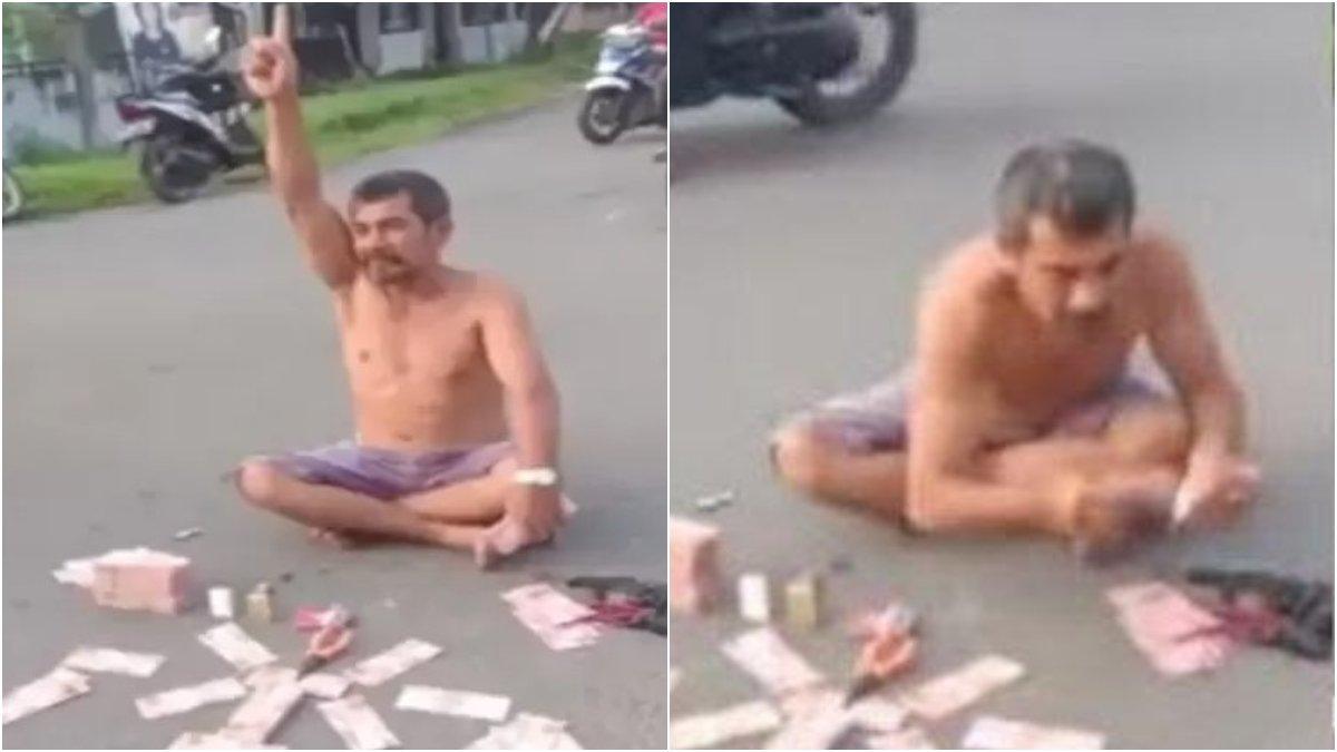 Viral di media sosial seorang pria pamer uang di Jalan Arion, Kecamatan Pandan, Kabupaten Tapanuli Tengah, Sumatera Utara.