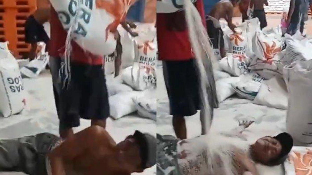 Viral seorang pria rebahan di beras Bulog