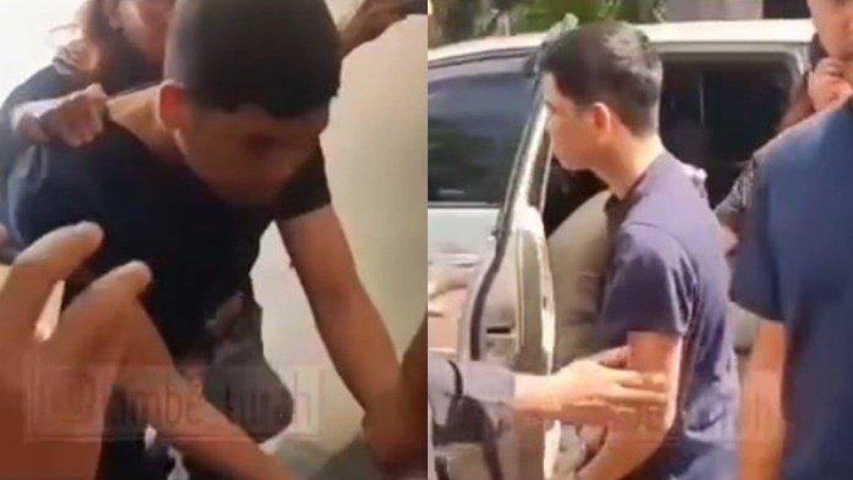 Yudha Arfandi kekasih Tamara Tyasmara tampak mengenakan kaos biru dongker hanya menunduk dengan tangan dipasang borgol.