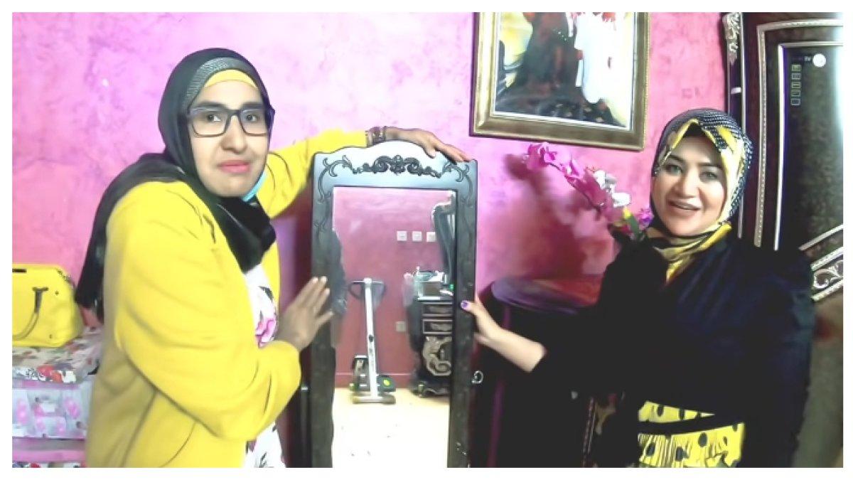 Sherly menunjukkan satu buah lemari besar yang berisi baju-baju mewah.